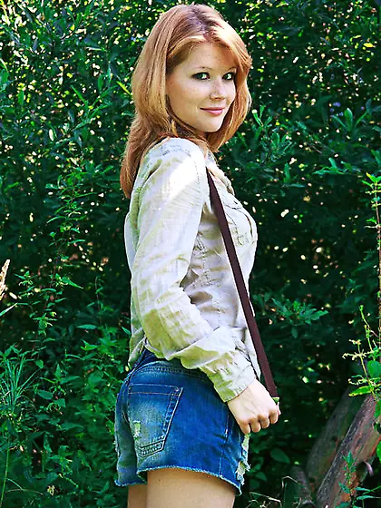 Slim ginger teeny demonstrates her natural curves on the wooden