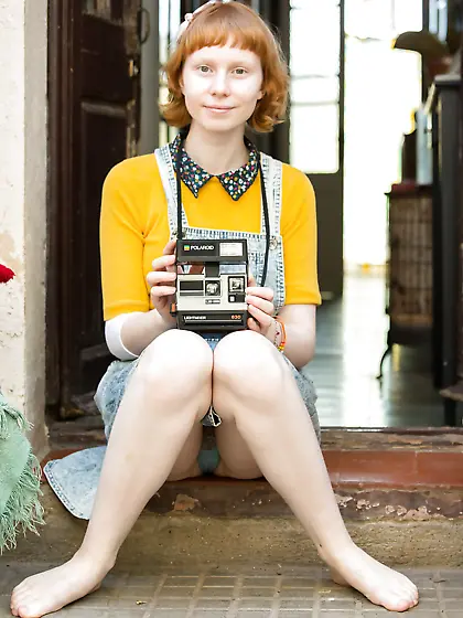 Redheaded beauty with a phat pussy shows her crotch big time