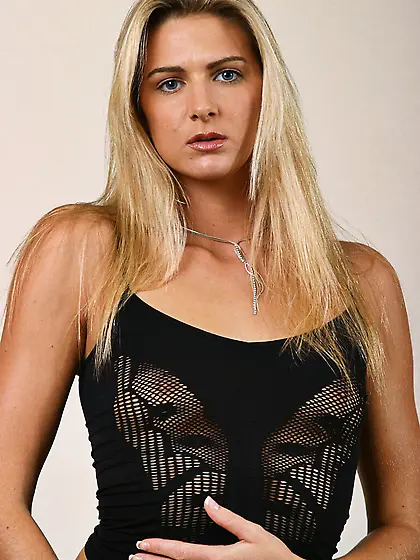 Long haired skinny blonde Ashley Long gets naked and opens her a