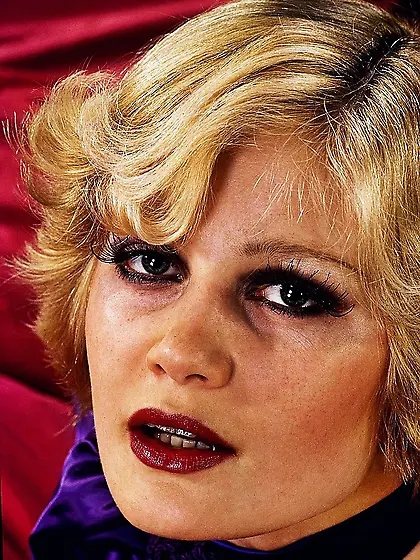 Blonde chick wearing violet