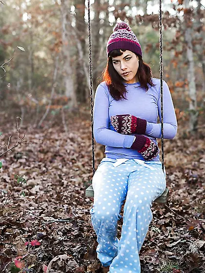 Female is alone on the swing and ignoring the weather she gets n