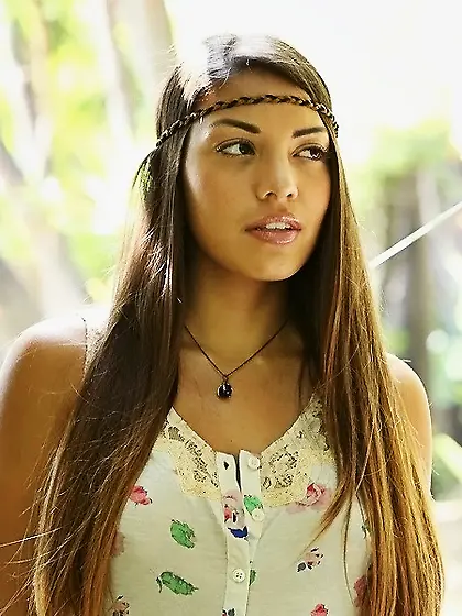 Hippie girl with tanned body is sure that nudity will save the w