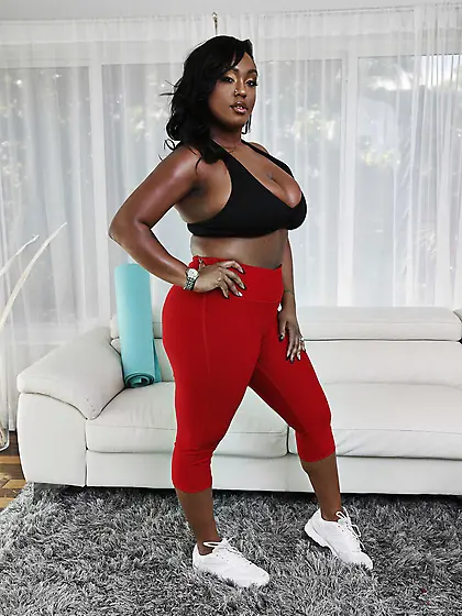 Busty black bitch doing yoga and having an interracial session