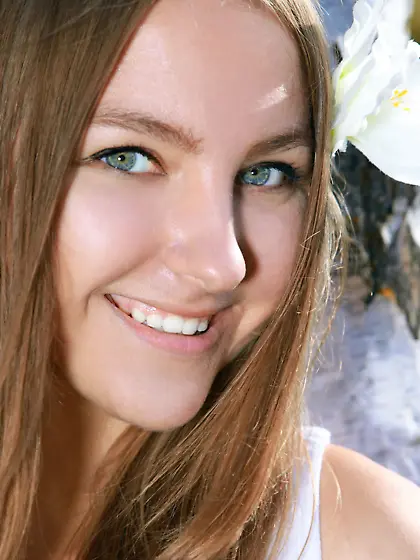 Exceedingly attractive teen stripping in the woods and smiling a