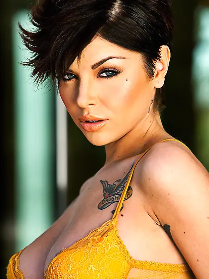 Jai Bella is outdoors as she strips naked for the camera.