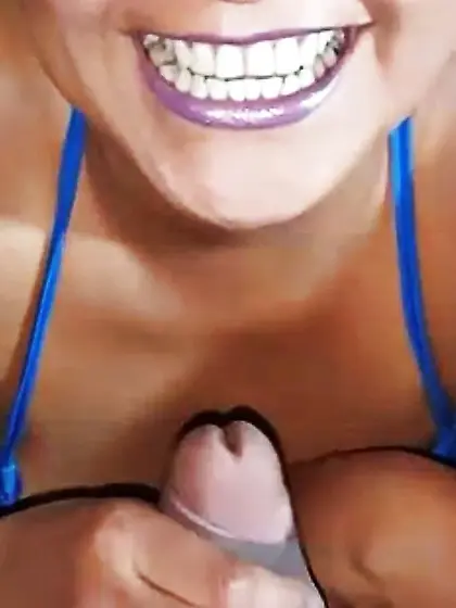 Smiling for a very fat cock