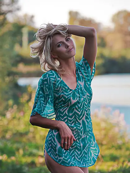 Excited slim blonde poses showing her small boobs and trimmed cu