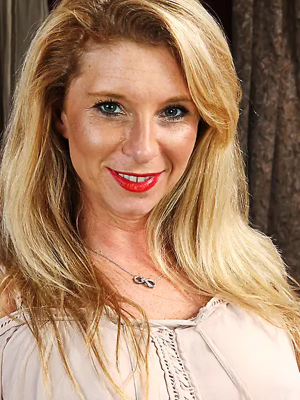 Beautiful MILF with blonde hair masturbates with a new toy on th