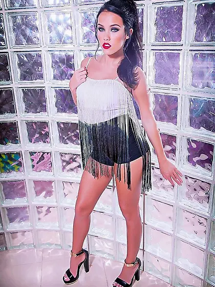 Shorts-wearing brunette wet masturbates