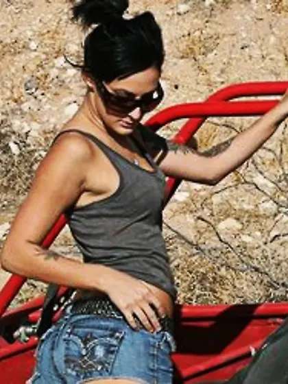 Brunette babe gets naked and spreads cute pierced pussy to be ca