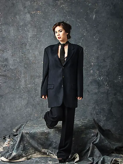 Wonderful brunette Mai Ly is hotly posing in men suit and then g