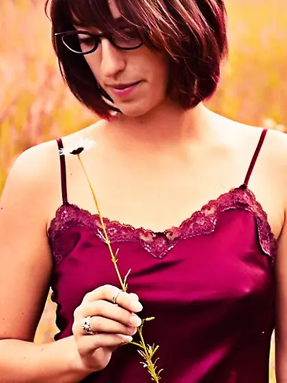 Frisky brunette teen Ryn Thomas demonstrates the naked holes dog