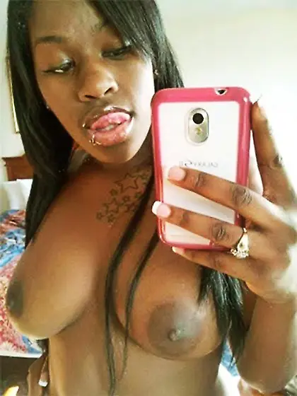 Tatted-up ebony GF flashing her pierced nipples