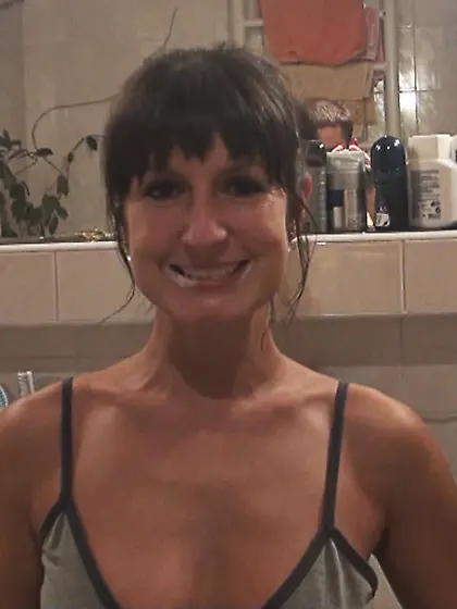 Brunette brushing teeth giving