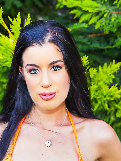 Brunette wears orange bikini