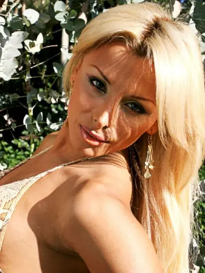 Tanned blonde shemale showing dick outdoor