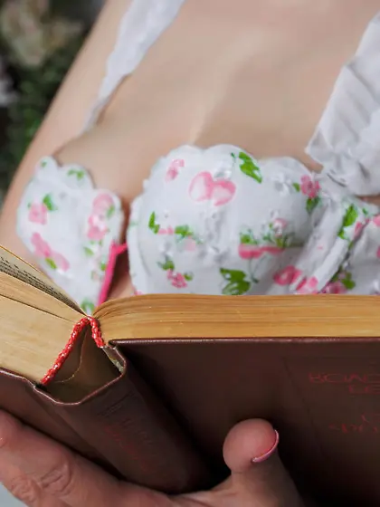 Flowery get-up brunette with blue eyes shows her holes and soles