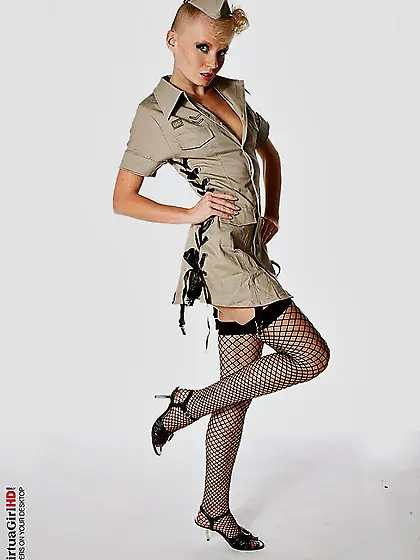 Looking like a pornstar from decades ago in black stockings and