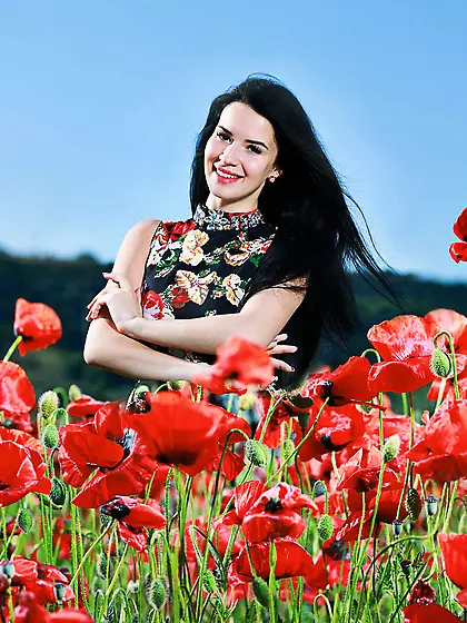 Pale-skinned raven-haired goddess showing her teen body in a fil