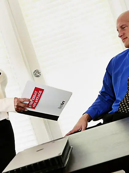 Curvaceous redhead secretary has fun with boss in the middle of