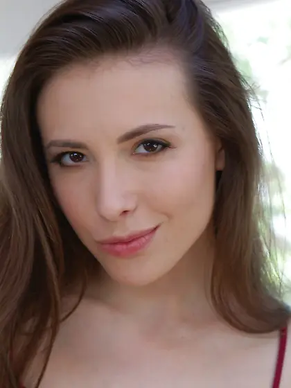 Playful brunette frees her body from blue tight leggings and red