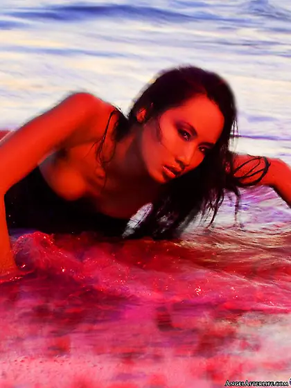 The half naked Asian chick Kaila Yu is petted by the tender ocea