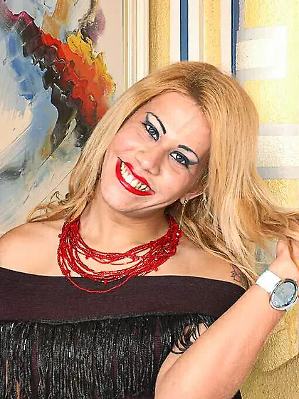 Blonde tranny wanking in bed