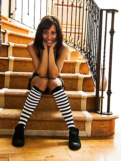 Courtney Page spreads her sexy legs on the sofa and passionately