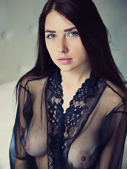 Brunette with nice boobies is showing off her ass and breasts