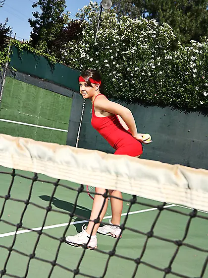 Penny Flame flaunts her hot ass and deep cleavage in a tennis dr