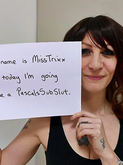 Tattooed brunette black dress