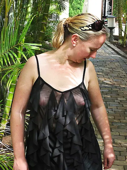 In a frilly black top on the street