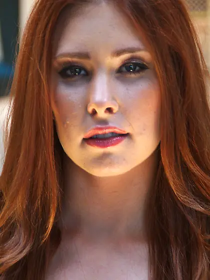 Melody Jordan grabs her ass after pulling down sexy leggings