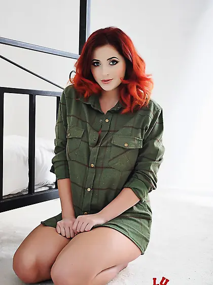 Real redhead beauty Lucy Vixen unbuttons the shirt and uncovers