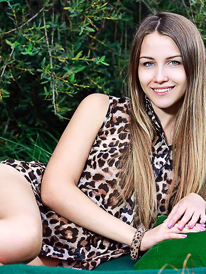 Blue-eyed blonde takes off her leopard-y get-up to pose complete