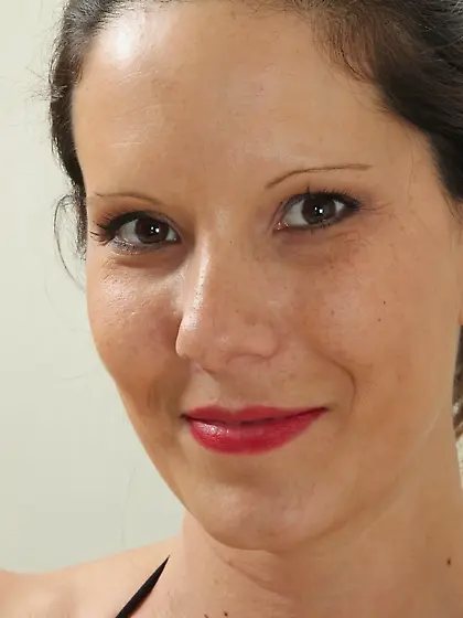 Dark-haired MILF with natural breasts and a black dress shows he