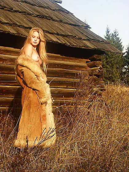 Andrea C takes her sexy fur coat outdoors and shows us her perky