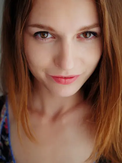 Beautiful redhead in a colorful top shows her fiery red pussy Vi