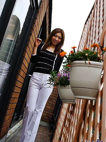 Asian chick Jun Idols looks into cam while it is recording her s