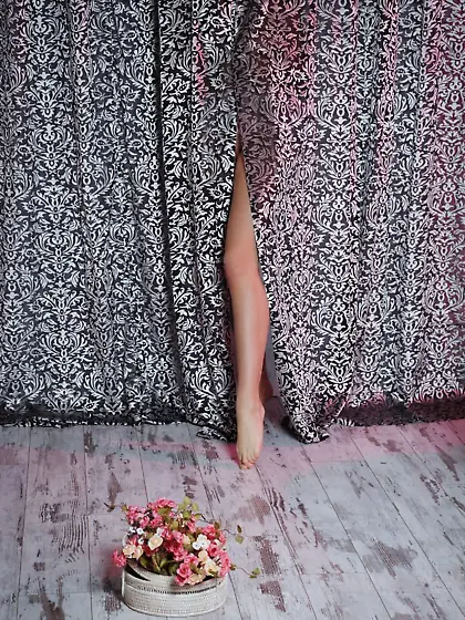 Dark-haired chick dressed in sexy lingerie flaunting her bald co