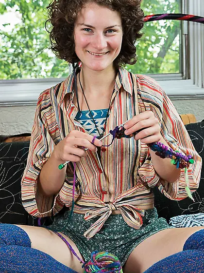 Girl in blue knit socks takes daily clothes off to wear leather