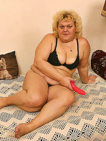 Mature blonde masturbates with a toy