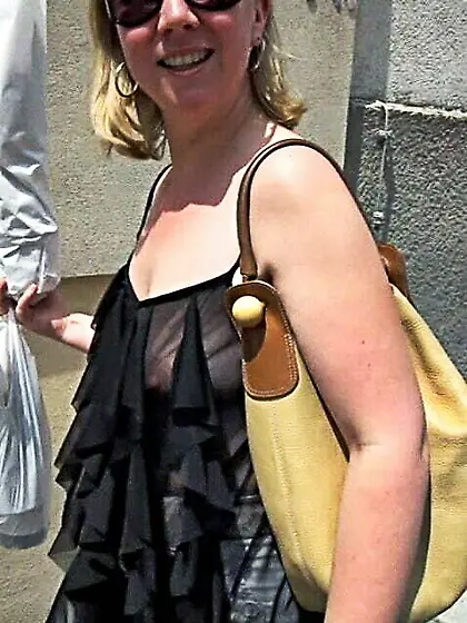 In a frilly black top on the street