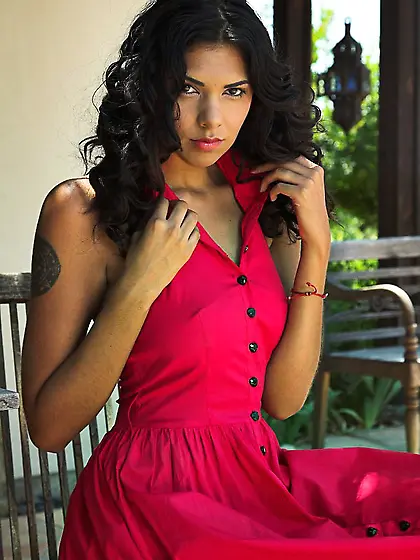 Lady in red Sochee Mala gets naked and shows her latin pussy in