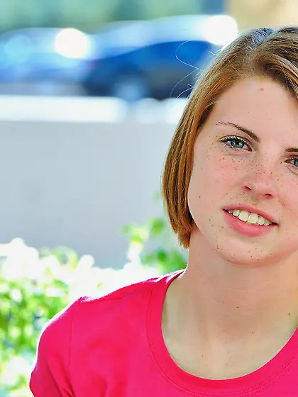 Aubrey Belle drops down her pink shirt and blue shorts and shows