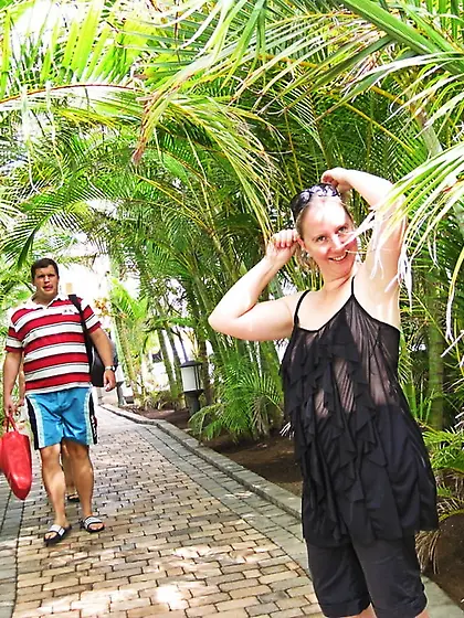In a frilly black top on the street