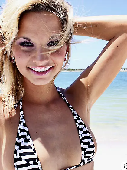 Innocent looking young gal takes off her bikini and enjoys in he