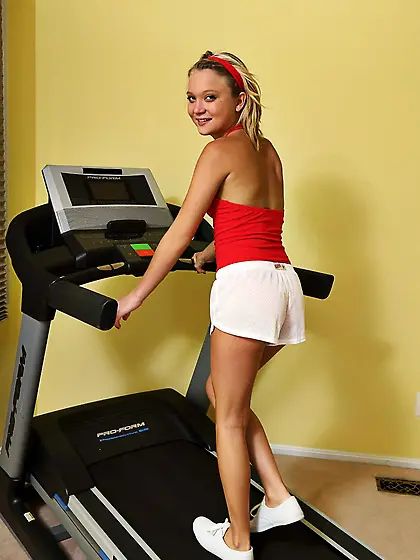 Shaved blonde Dakota Skye strips on the treadmill and spreads he