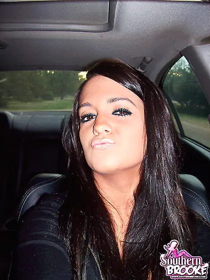 Busty brunette slut Southern Brooke takes off her clothes and sh