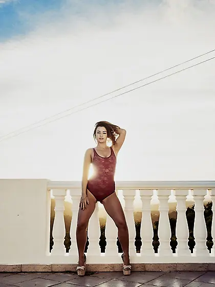 Stunning teen on heels doffs lingerie bodysuit to expose her sex